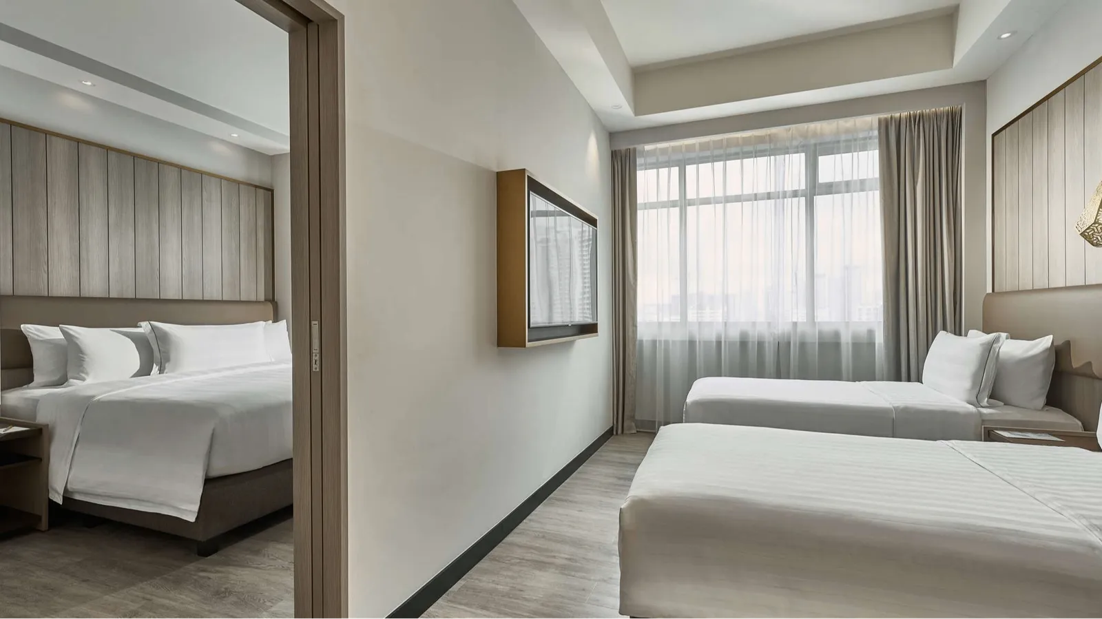 Family quadruple room with one king bed two single beds