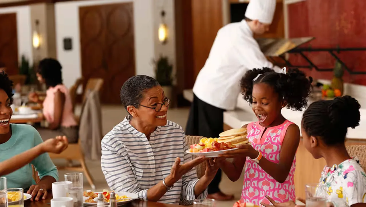 Family enjoying breakfast. Breakfast Included